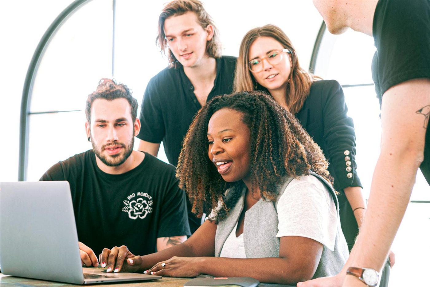 A diverse team collaborating in a modern workplace